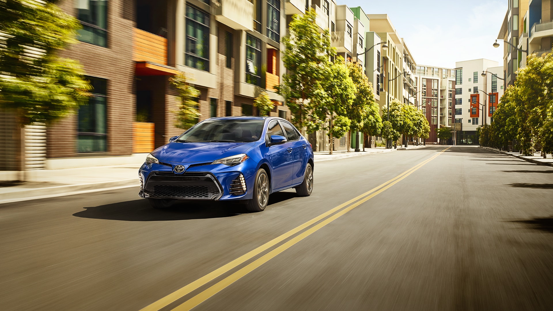 2019 Toyota Corolla blue color in city on road front side view 1080p uhd wallpaper